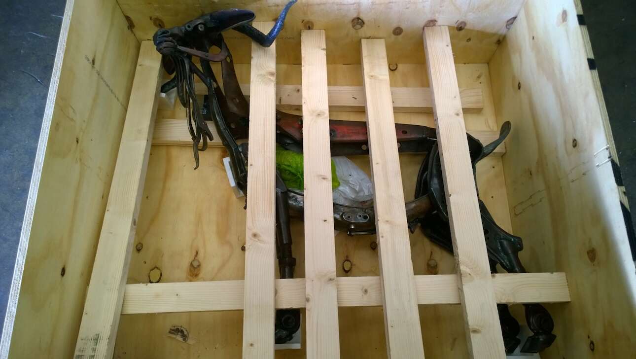 A steel animal ornament packed in a shipping container ready for delivery